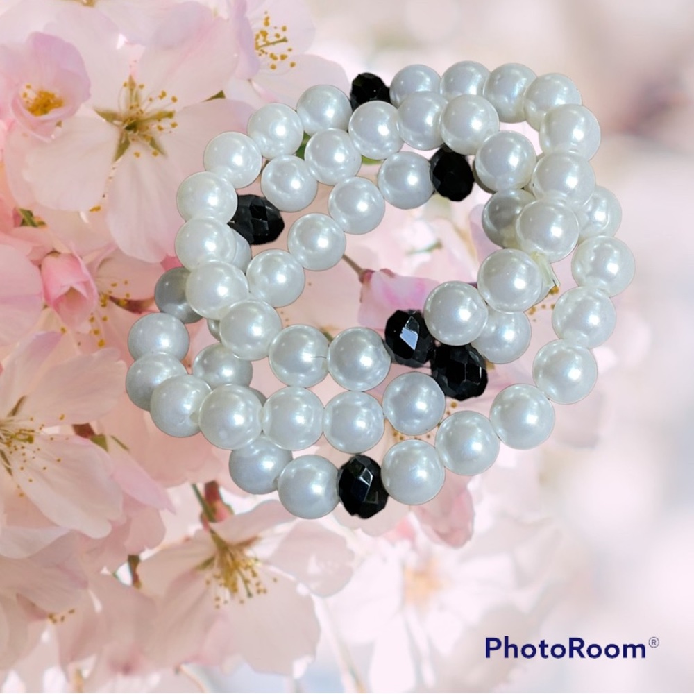 Set of 3 bracelets. White beads with 2 black beads in each